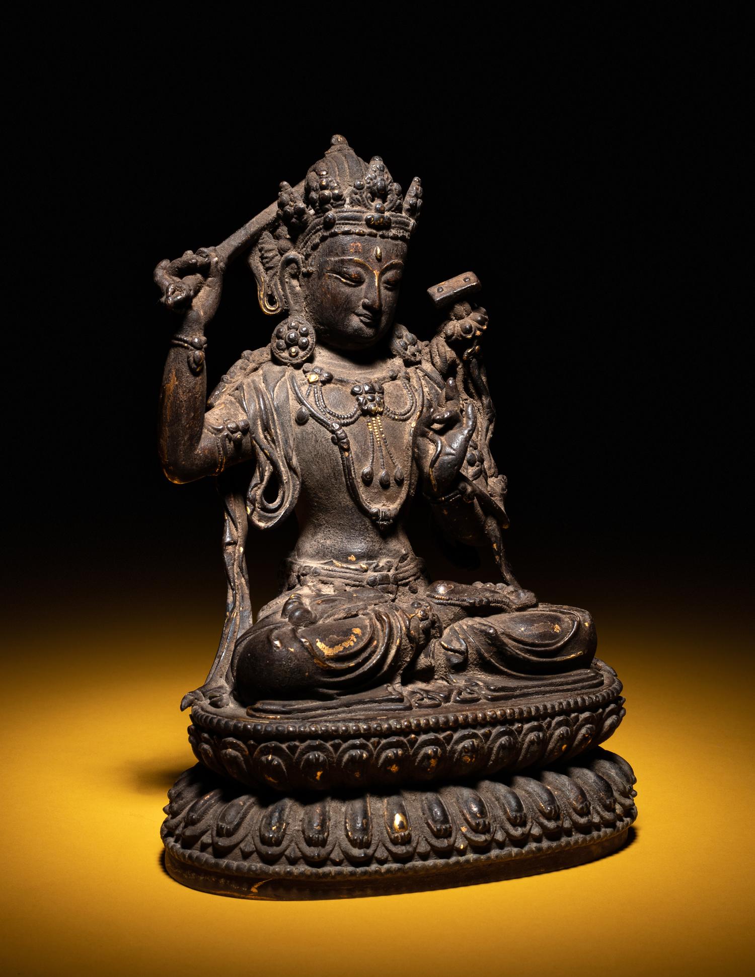 A Sino-Tibetan Parcel-Gilt Bronze Figure of Manjushri