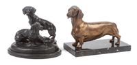 Two Dachshund Figures Width of wider base 8 inches.