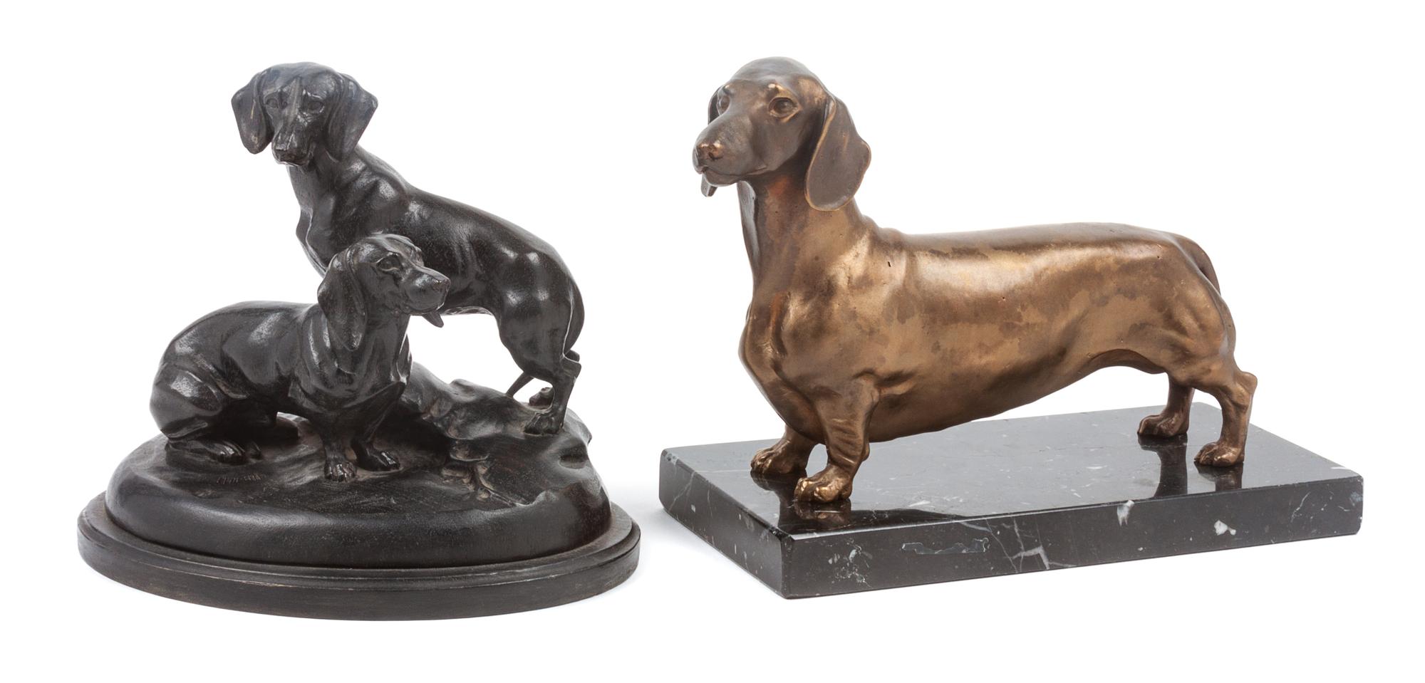 Two Dachshund Figures Width of wider base 8 inches.