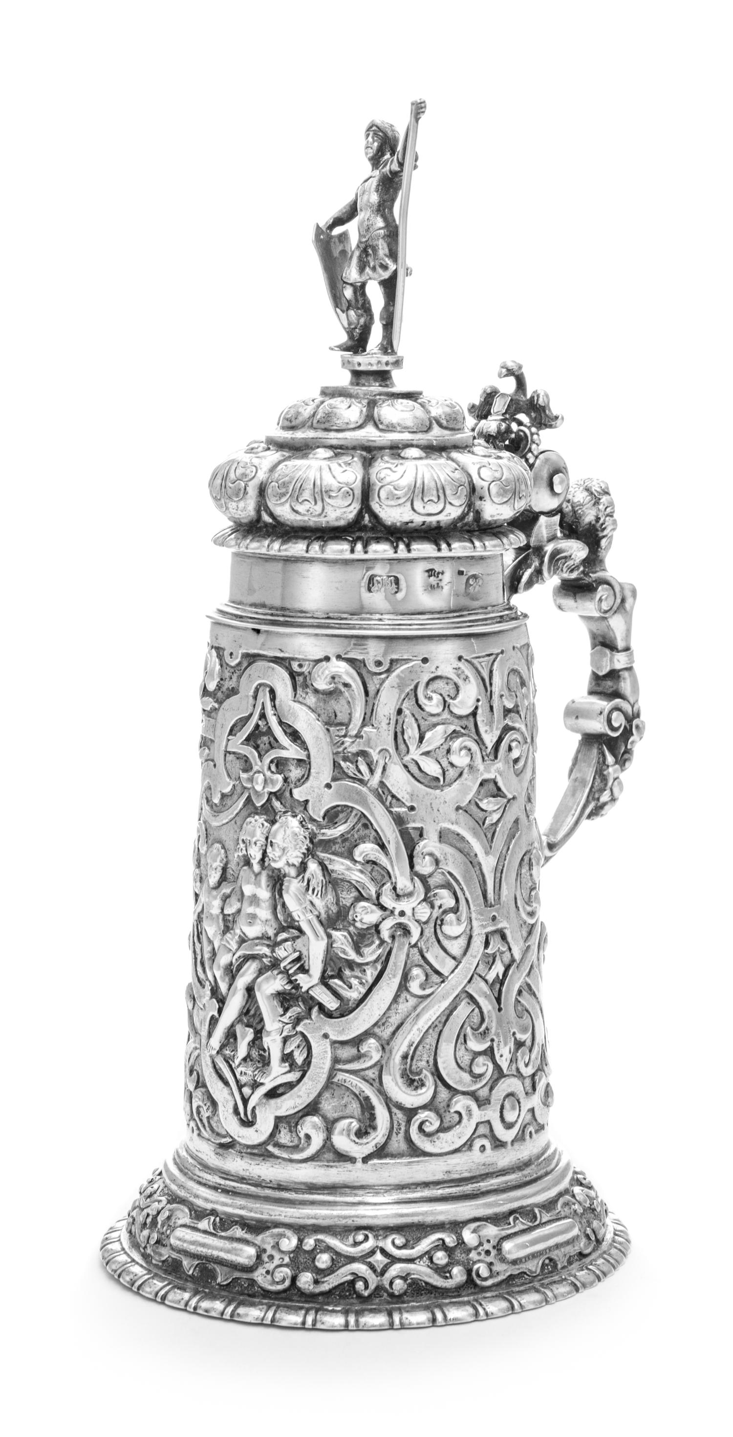An Estonian Silver Tankard, Maker's Mark ET, Tallinn, Late 19th Century, having a domed cover surmounted by a figural finial, the body