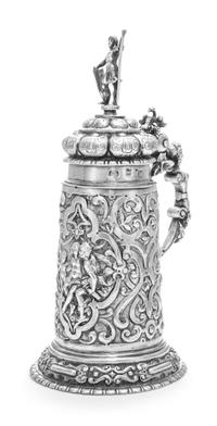 An Estonian Silver Tankard, Maker's Mark ET, Tallinn, Late 19th Century, having a domed cover surmounted by a figural finial, the body