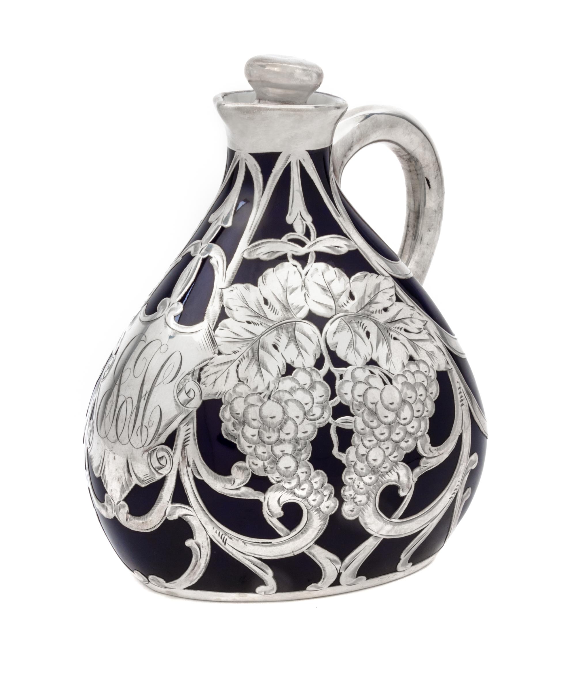 A Porcelain Silver Overlay Pitcher Height 7 inches.