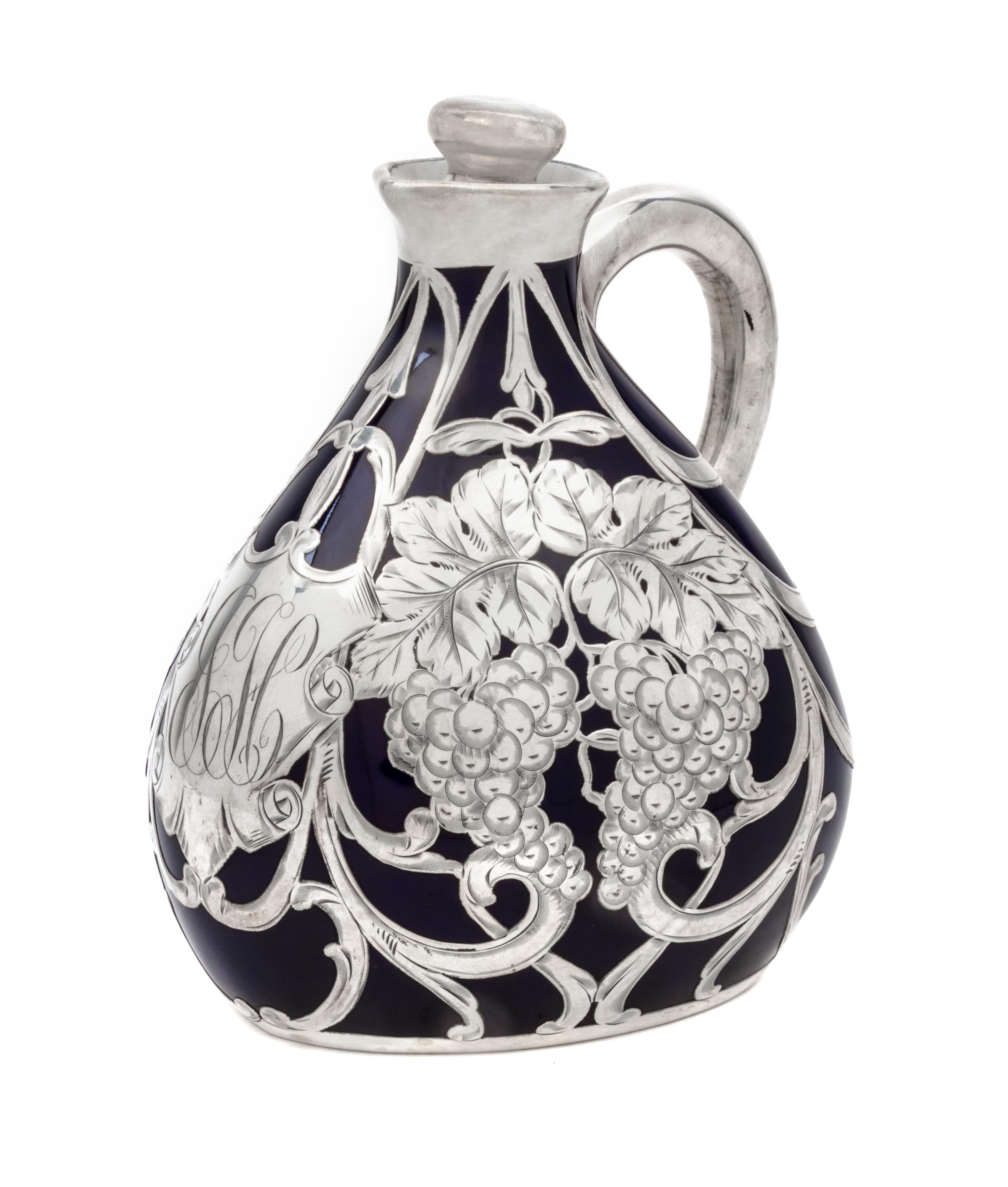 A Porcelain Silver Overlay Pitcher Height 7 inches.