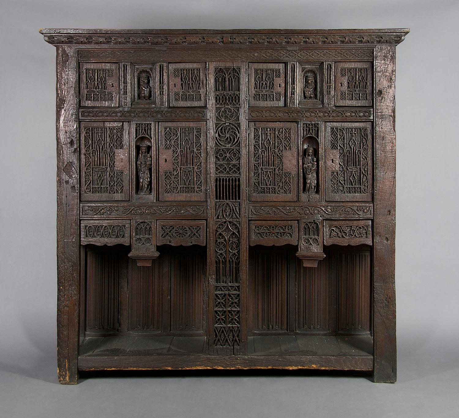 A Renaissance Revival Carved Oak Court Cupboard, Height 77 x width 79 1/2 x depth 22 3/4 inches.