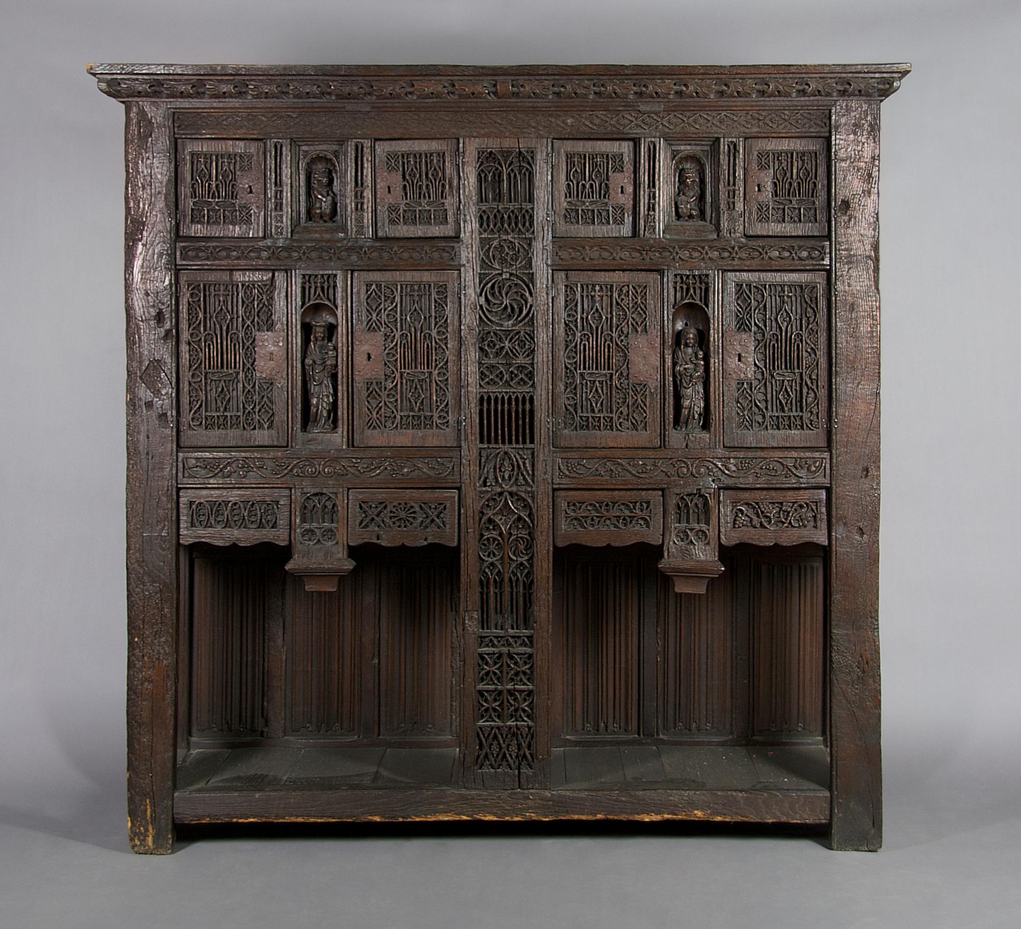 A Renaissance Revival Carved Oak Court Cupboard, Height 77 x width 79 1/2 x depth 22 3/4 inches.