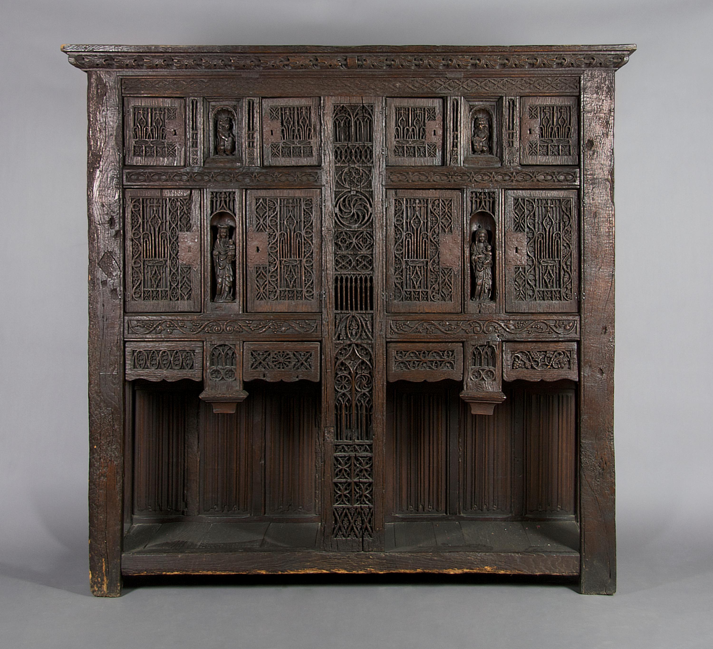 A Renaissance Revival Carved Oak Court Cupboard, Height 77 x width 79 1/2 x depth 22 3/4 inches.