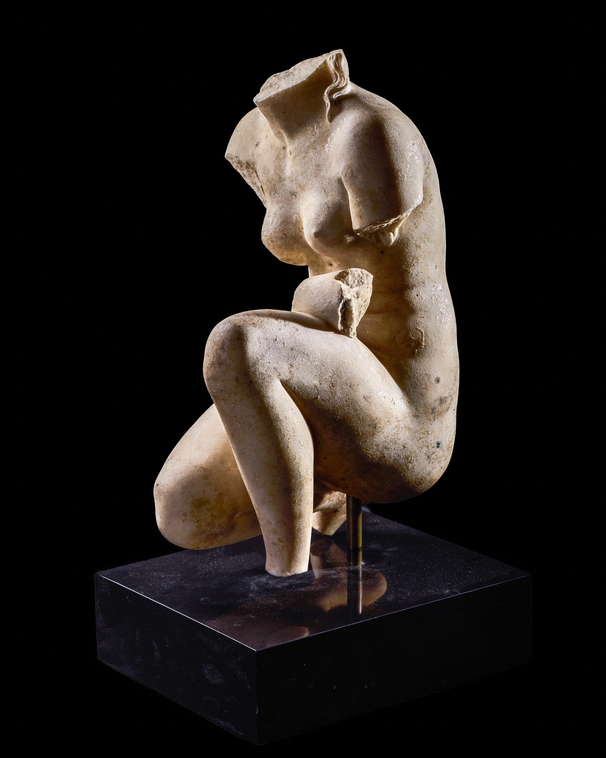 A Roman Marble Crouching Venus
