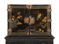 A Chinese Black and Gilt Lacquered Cabinet on Stand