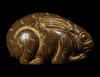 A Chinese Parcel Gilt Bronze Rabbit-Form Paper Weight
