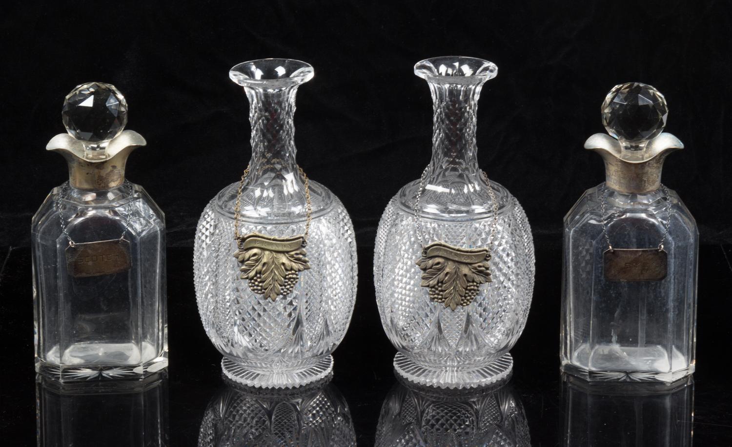 A Group of Cut Glass Decanters Height of first pair 9 1/4 inches.