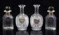 A Group of Cut Glass Decanters Height of first pair 9 1/4 inches.