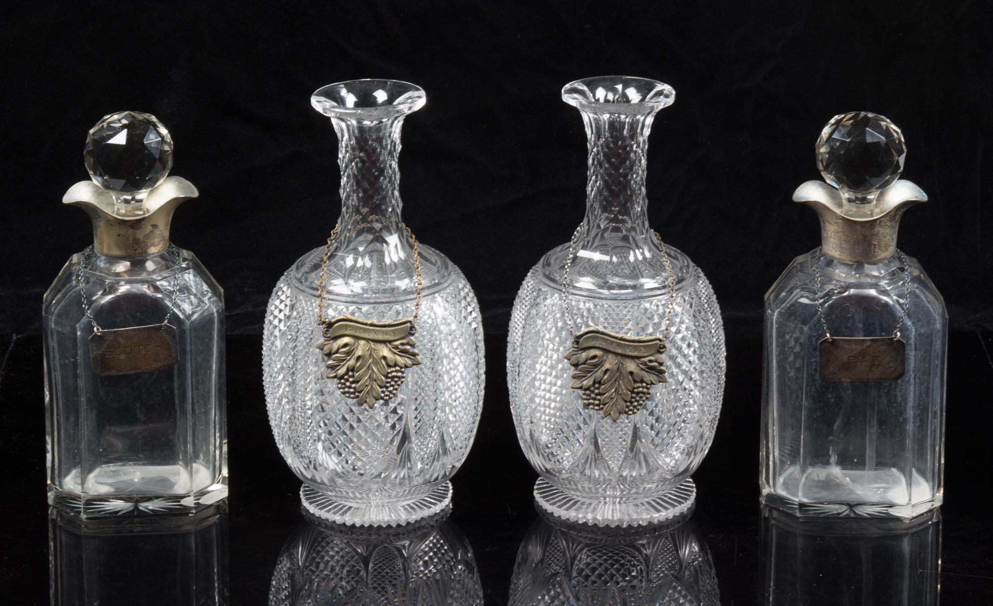 A Group of Cut Glass Decanters Height of first pair 9 1/4 inches.