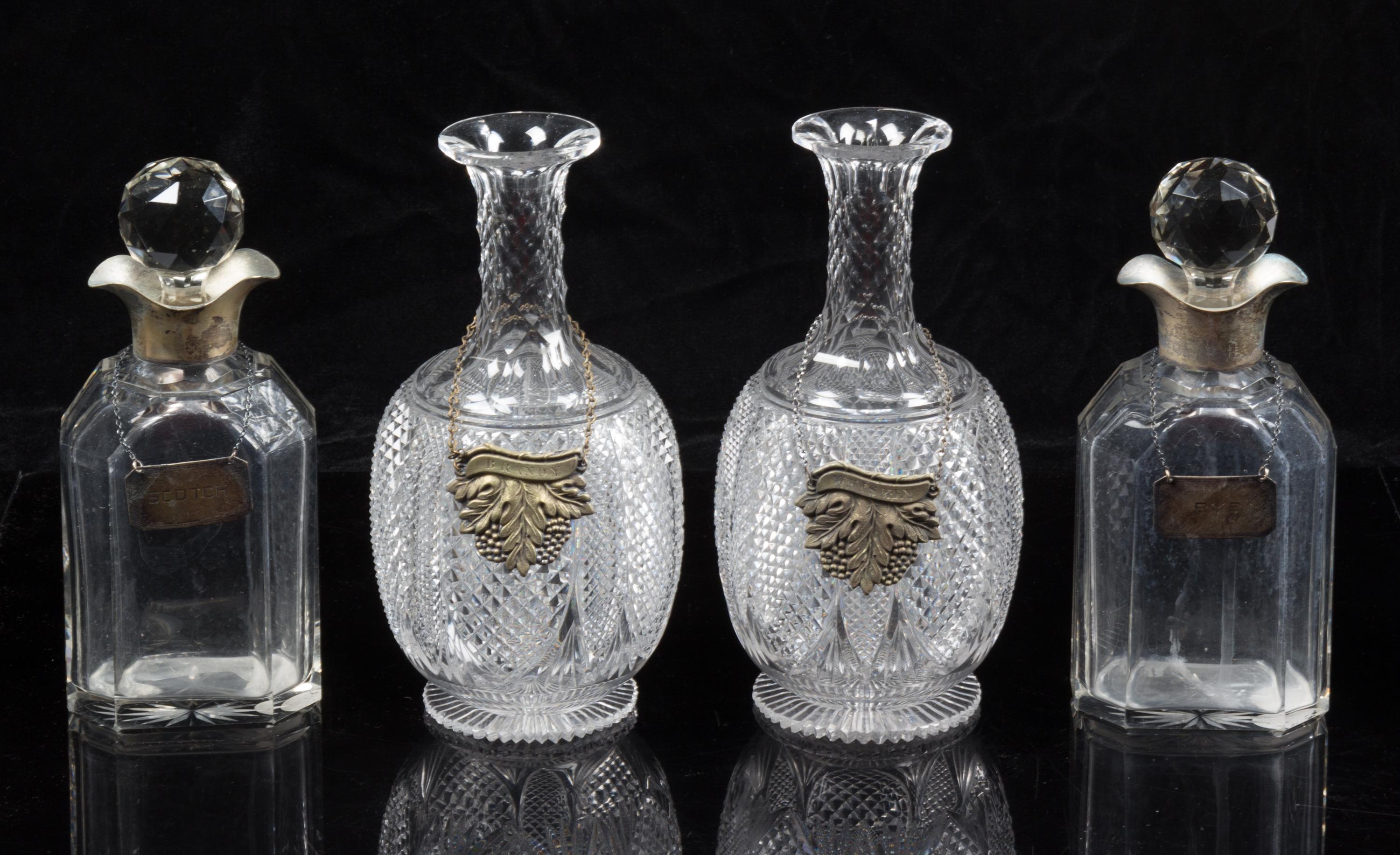 A Group of Cut Glass Decanters Height of first pair 9 1/4 inches.