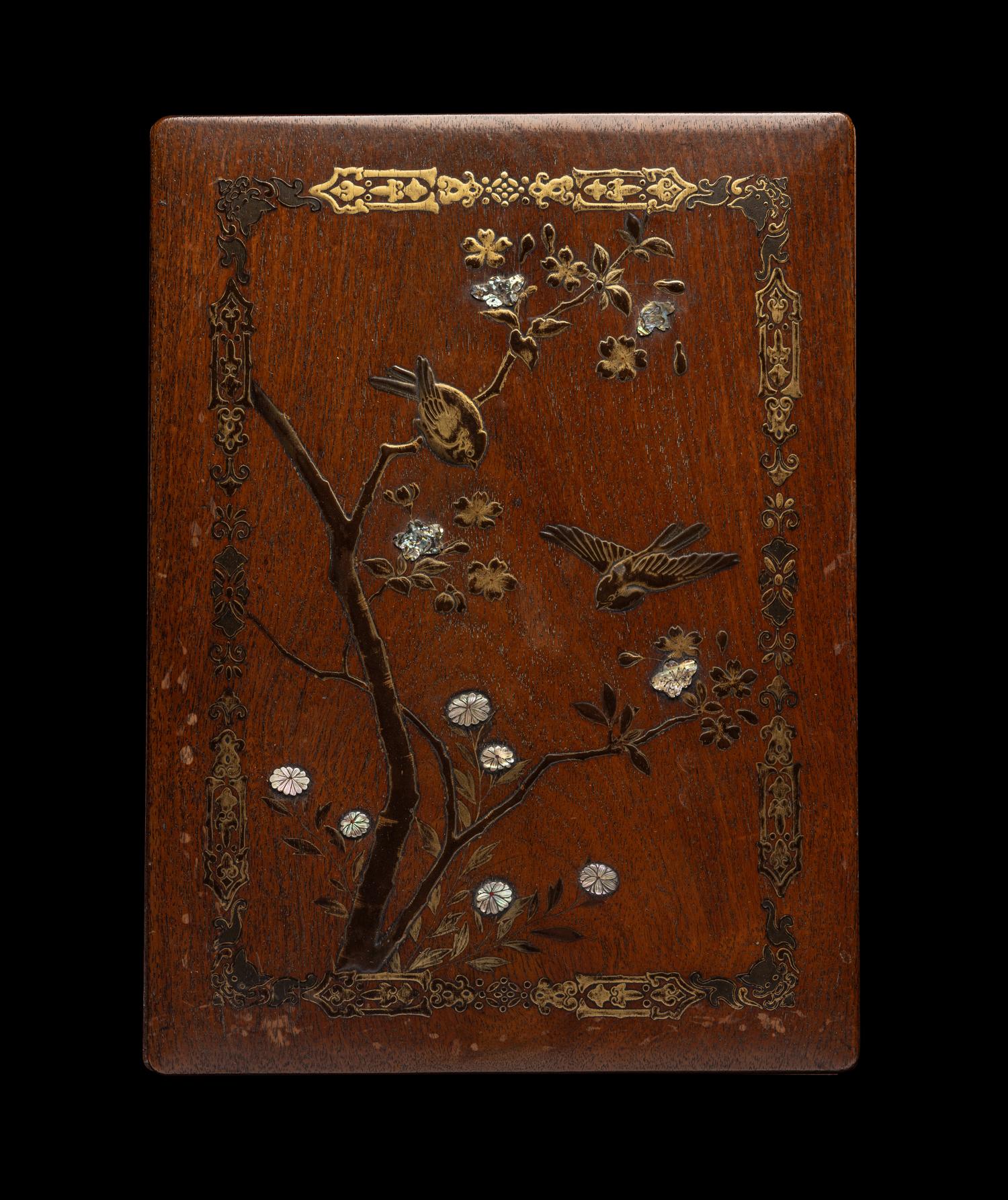 A Japanese Mother-of-Pearl Inlaid Gilt and Black Lacquered Hardwood Stationary Box