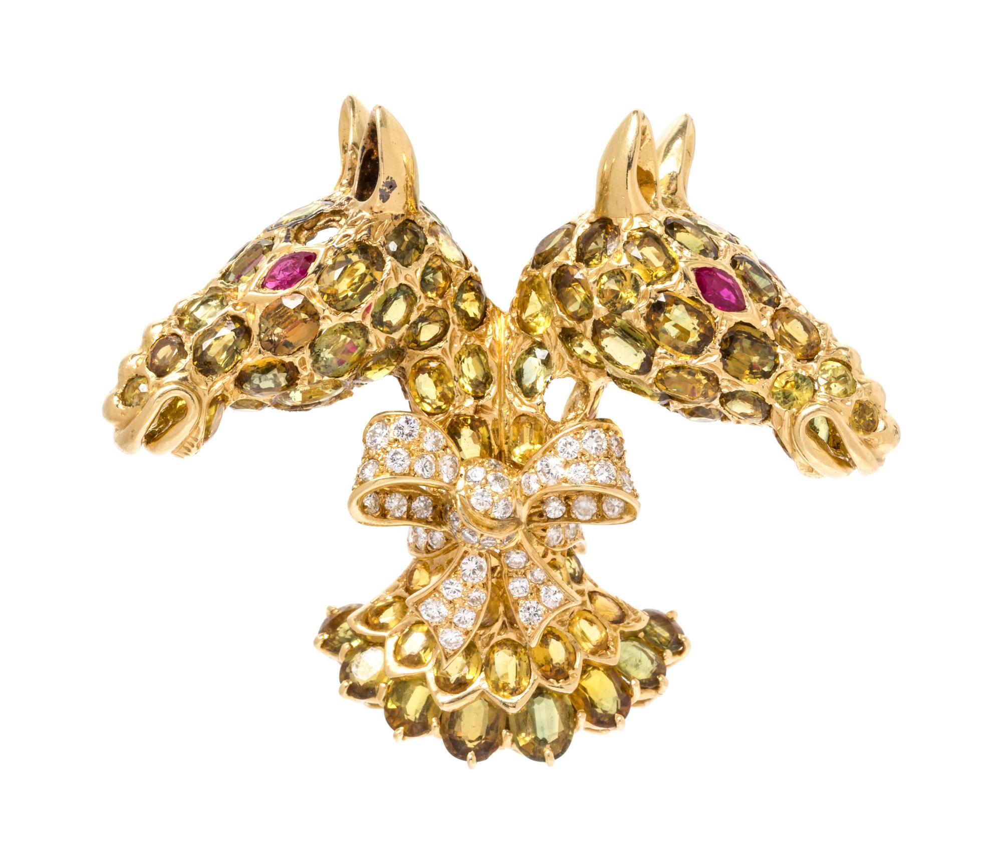 An 18 Karat Yellow Gold, Sapphire, Ruby and Diamond Twin Horse Head Brooch, Tiffany & Co., 30.90 dwts.
