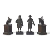 A Group of Four Patinated Bronze Figures or Bookends