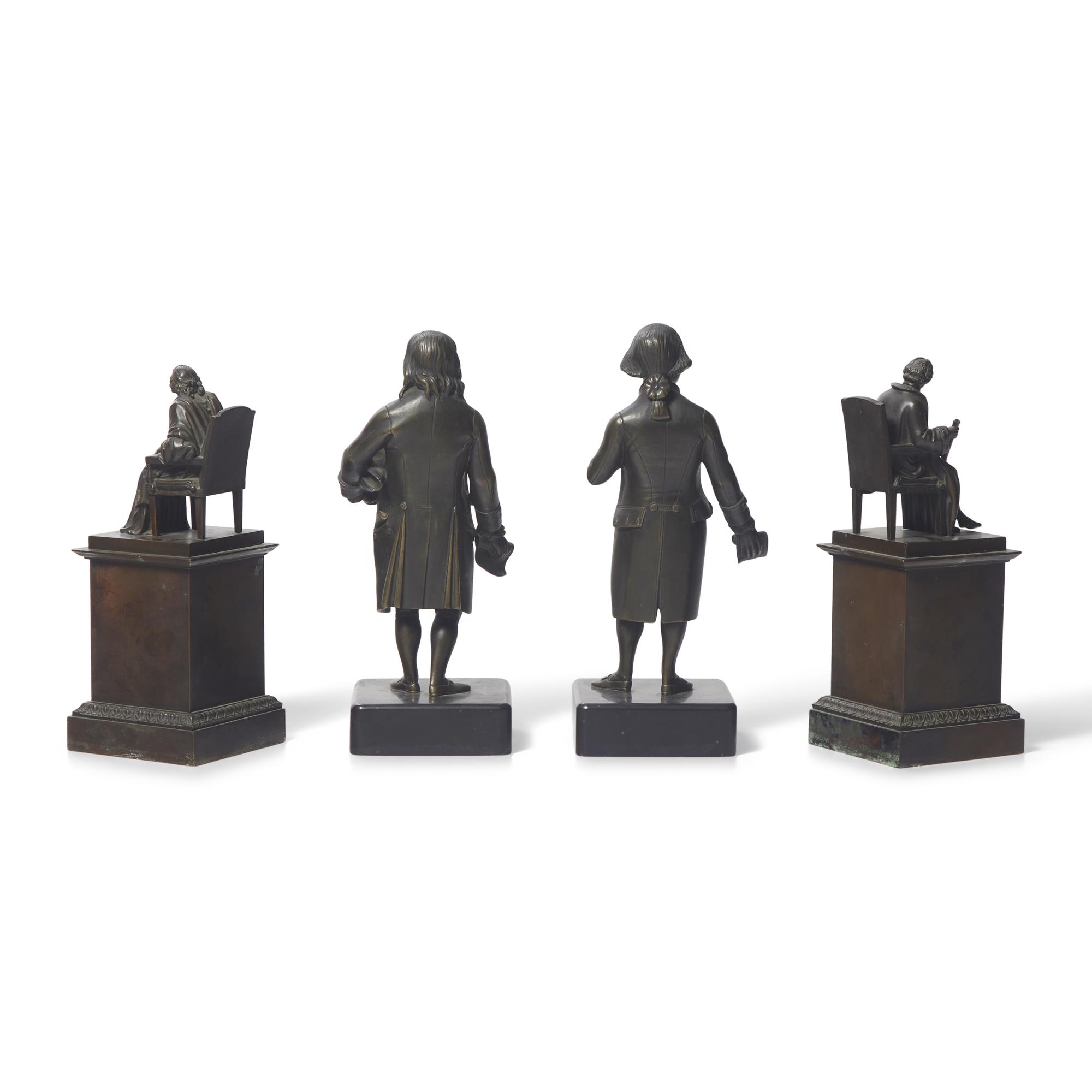 A Group of Four Patinated Bronze Figures or Bookends