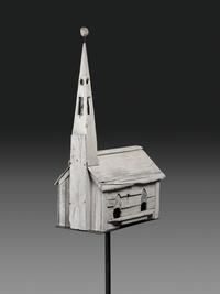 A Carved Wood Church Form Bird House on Stand