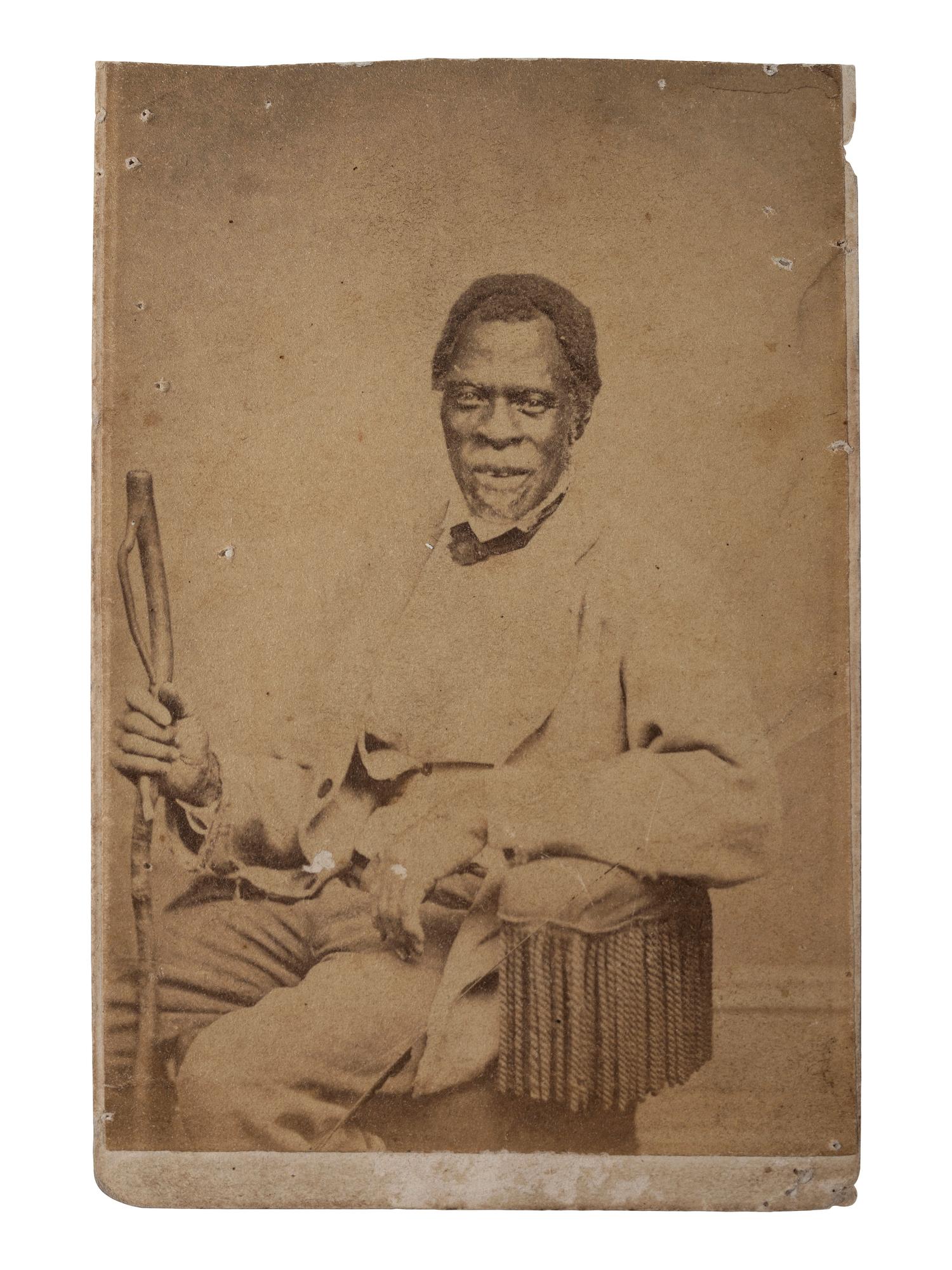 [AFRICAN AMERICANA] -- [EARLY PHOTOGRAPHY]. MILLER HORNING, J., photographer. CDV of aged African American man with walking stick.