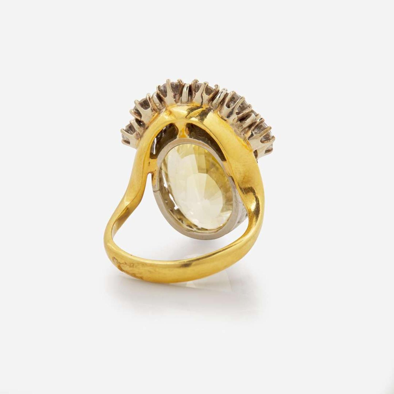 An 18K Yellow Gold, Platinum, Diamond, and Yellow Sapphire Ring