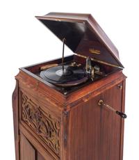 A Silvertone Carved and Stained Wood Tall Case Phonograph