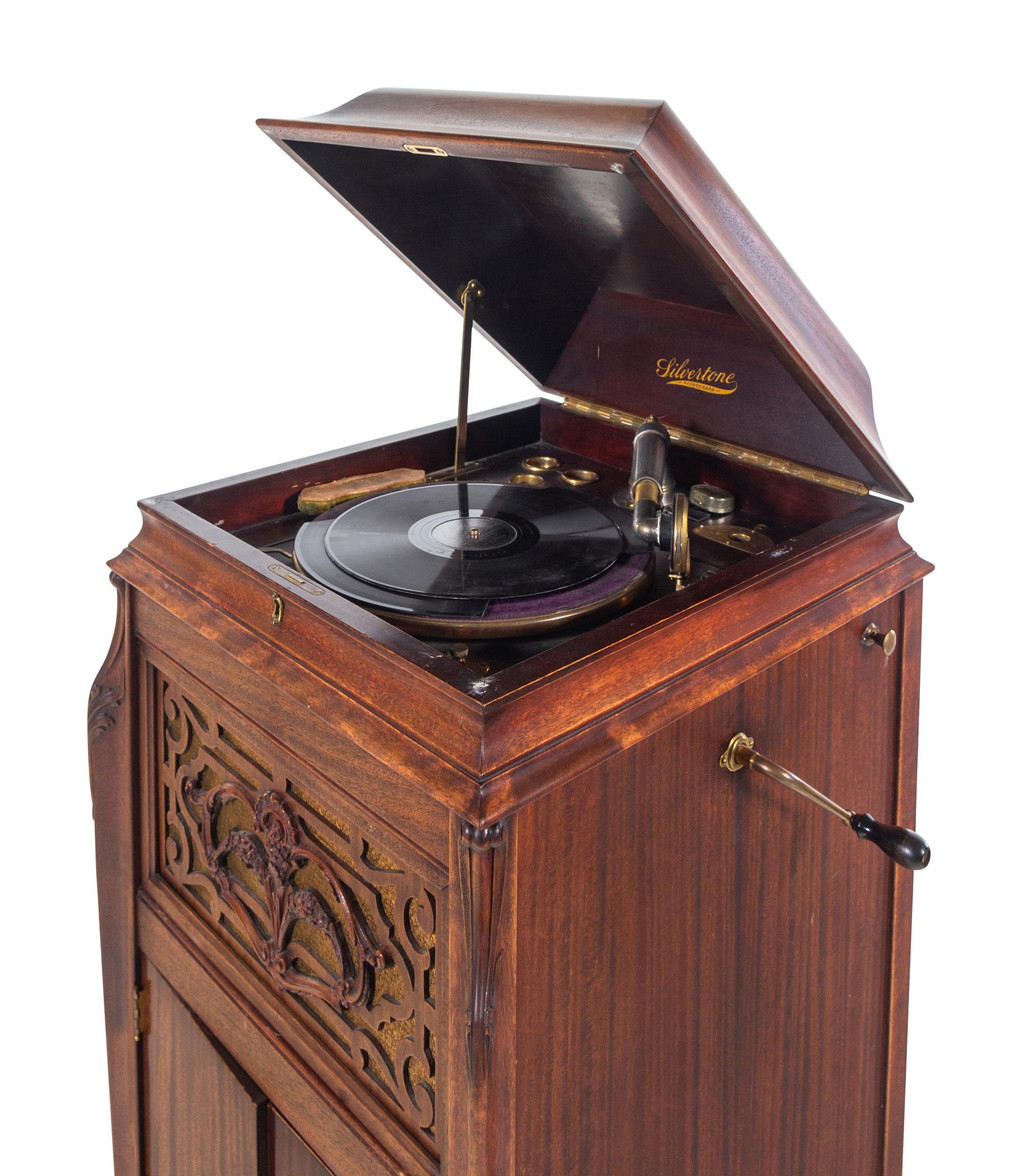 A Silvertone Carved and Stained Wood Tall Case Phonograph