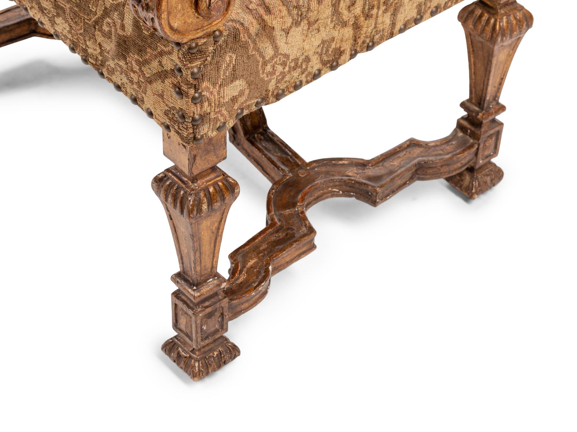 A Pair of Louis XIV Giltwood Armchairs