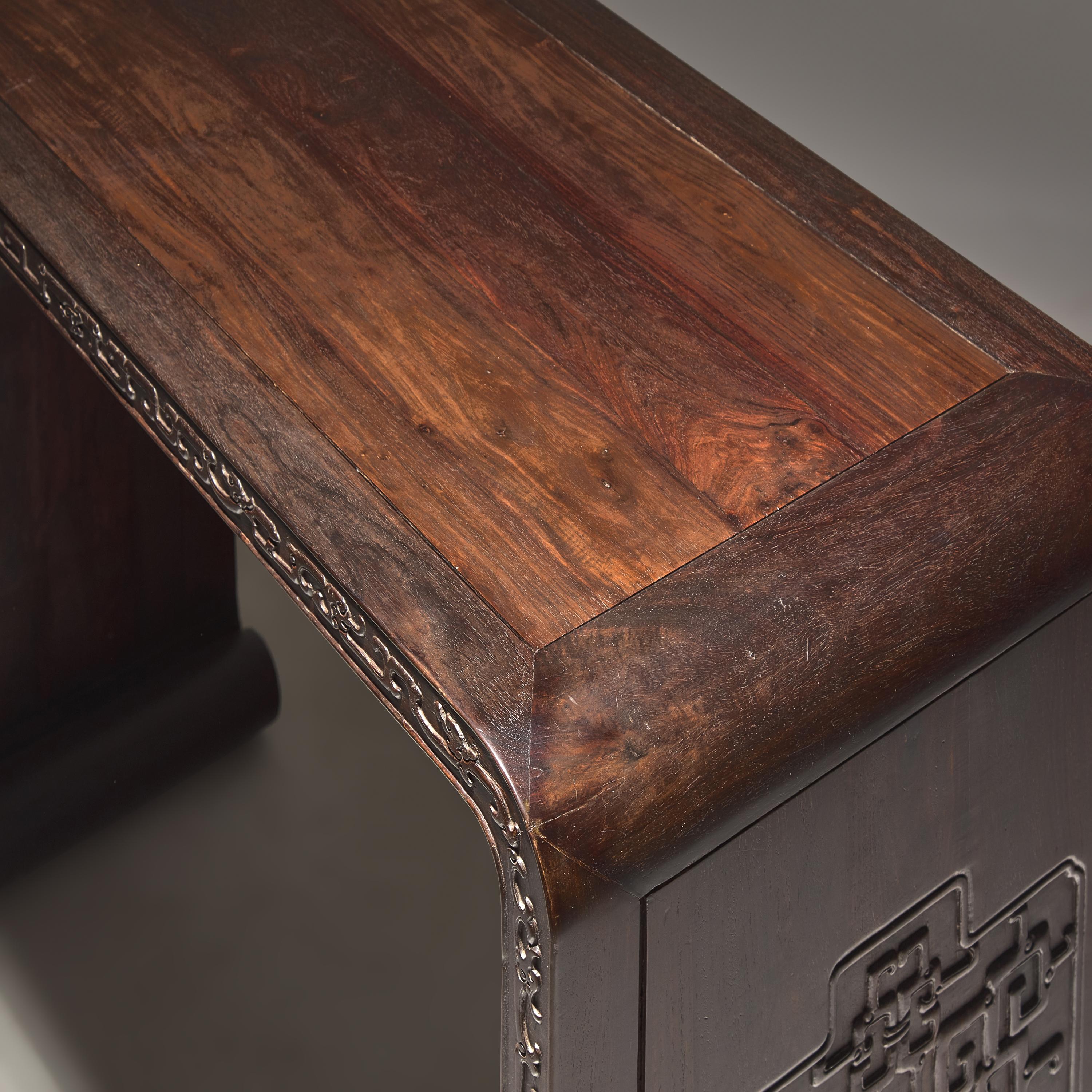 A Chinese Zitan and Hardwood Scroll-Form Altar Table — 紫檀及硬木夔龍紋下卷式小條案