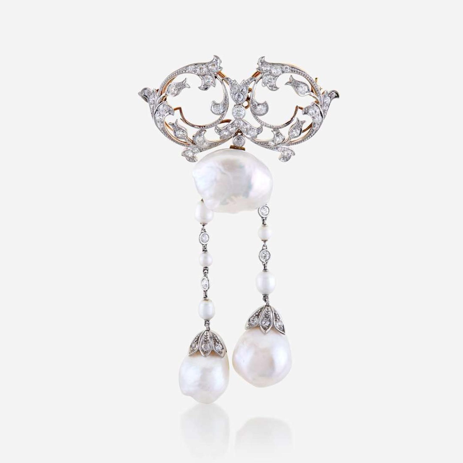 A natural pearl, diamond, eighteen karat gold, and platinum brooch