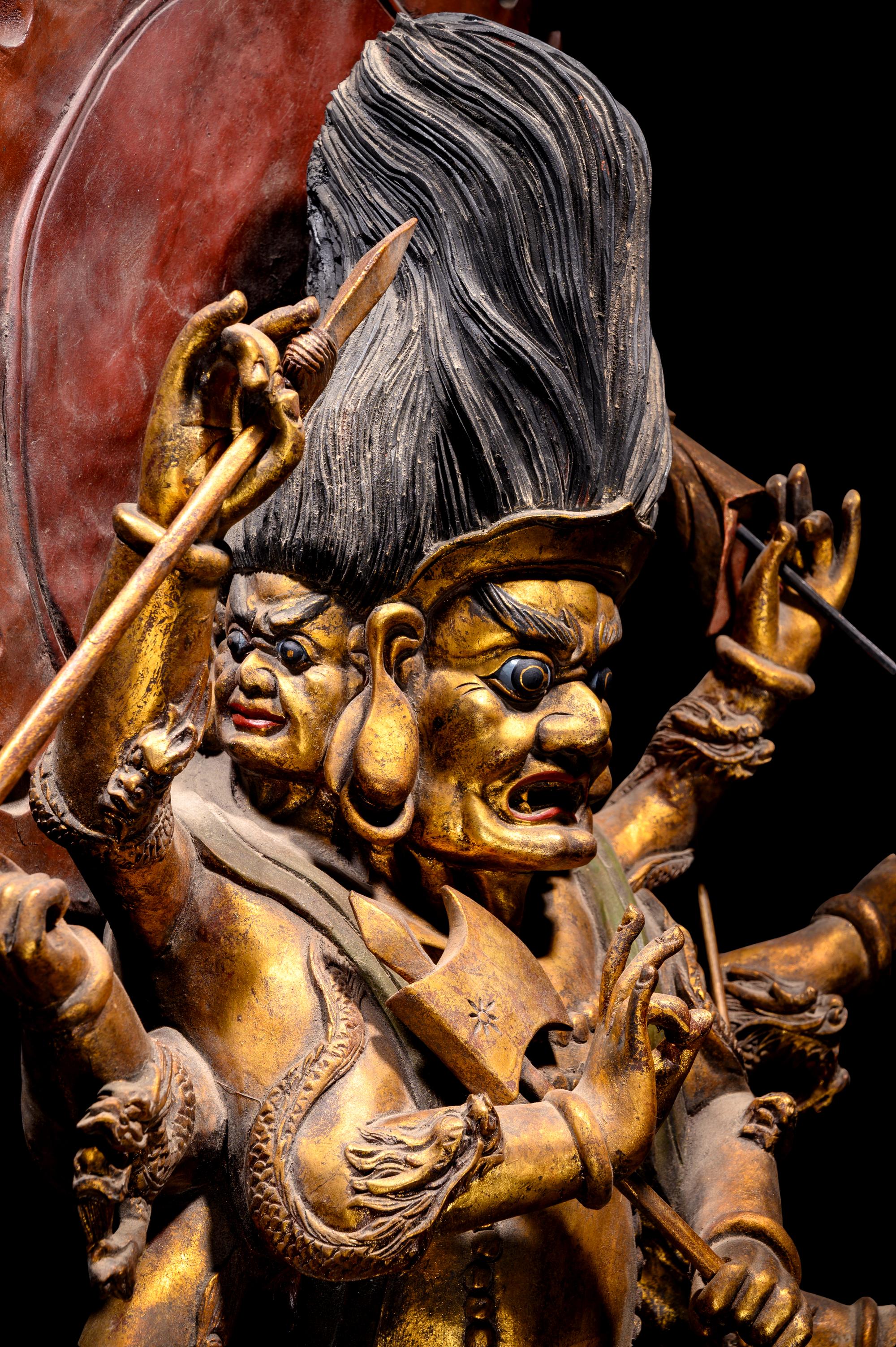 A Large Gilt and Red Lacquered Wood Figure of Mahakala