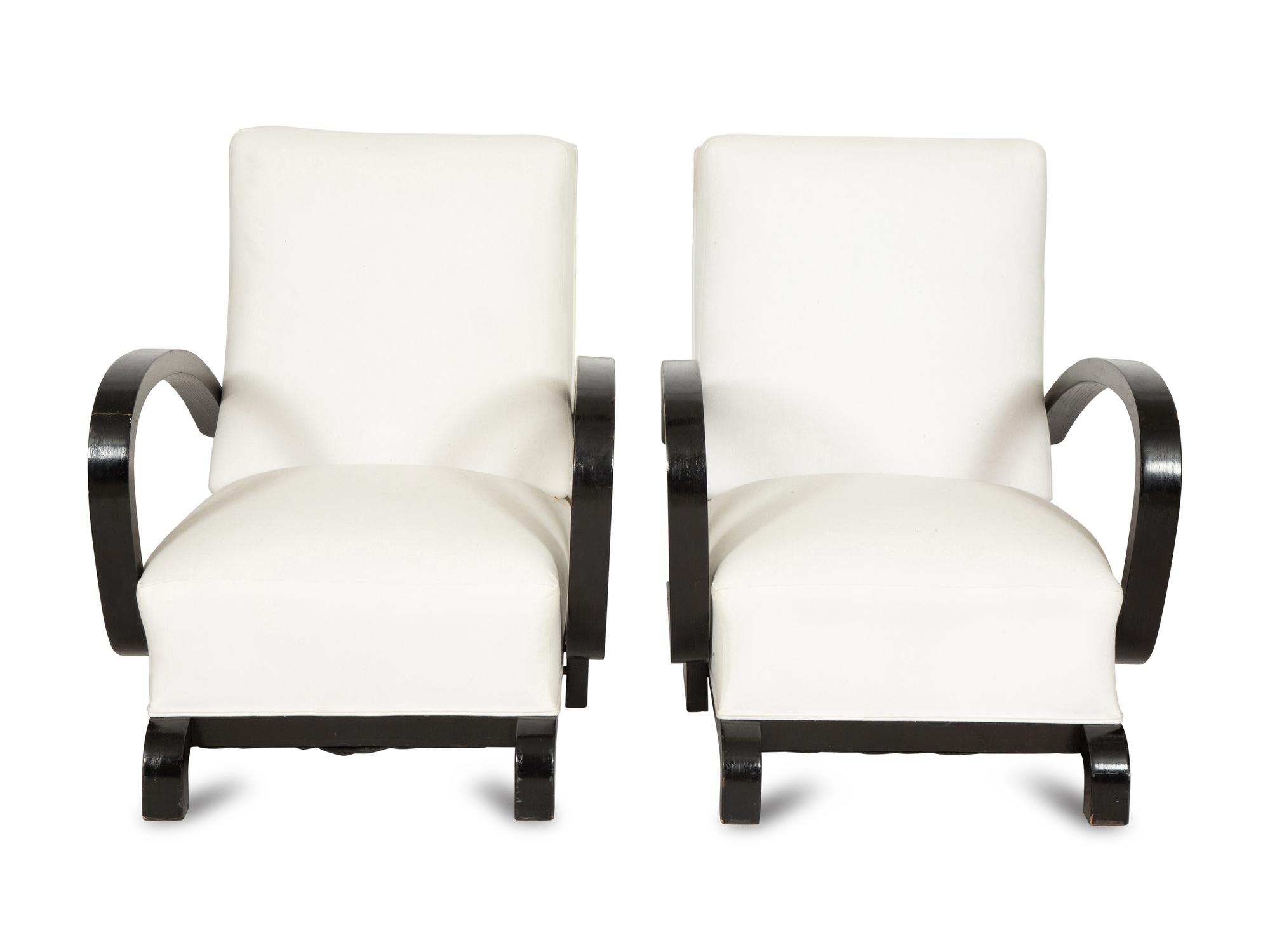 A Pair of Ebonized Oak Lounge Chairs