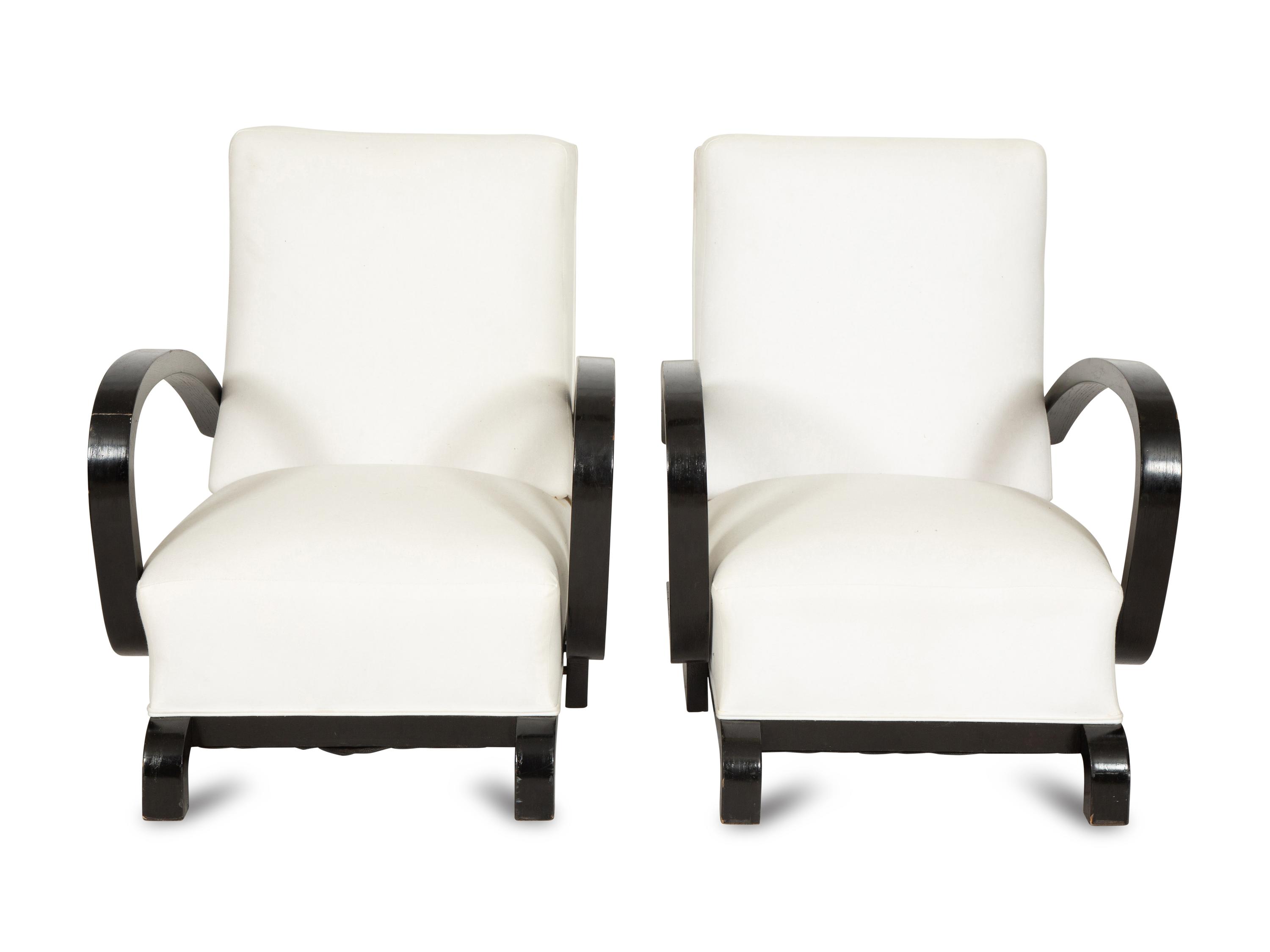 A Pair of Ebonized Oak Lounge Chairs