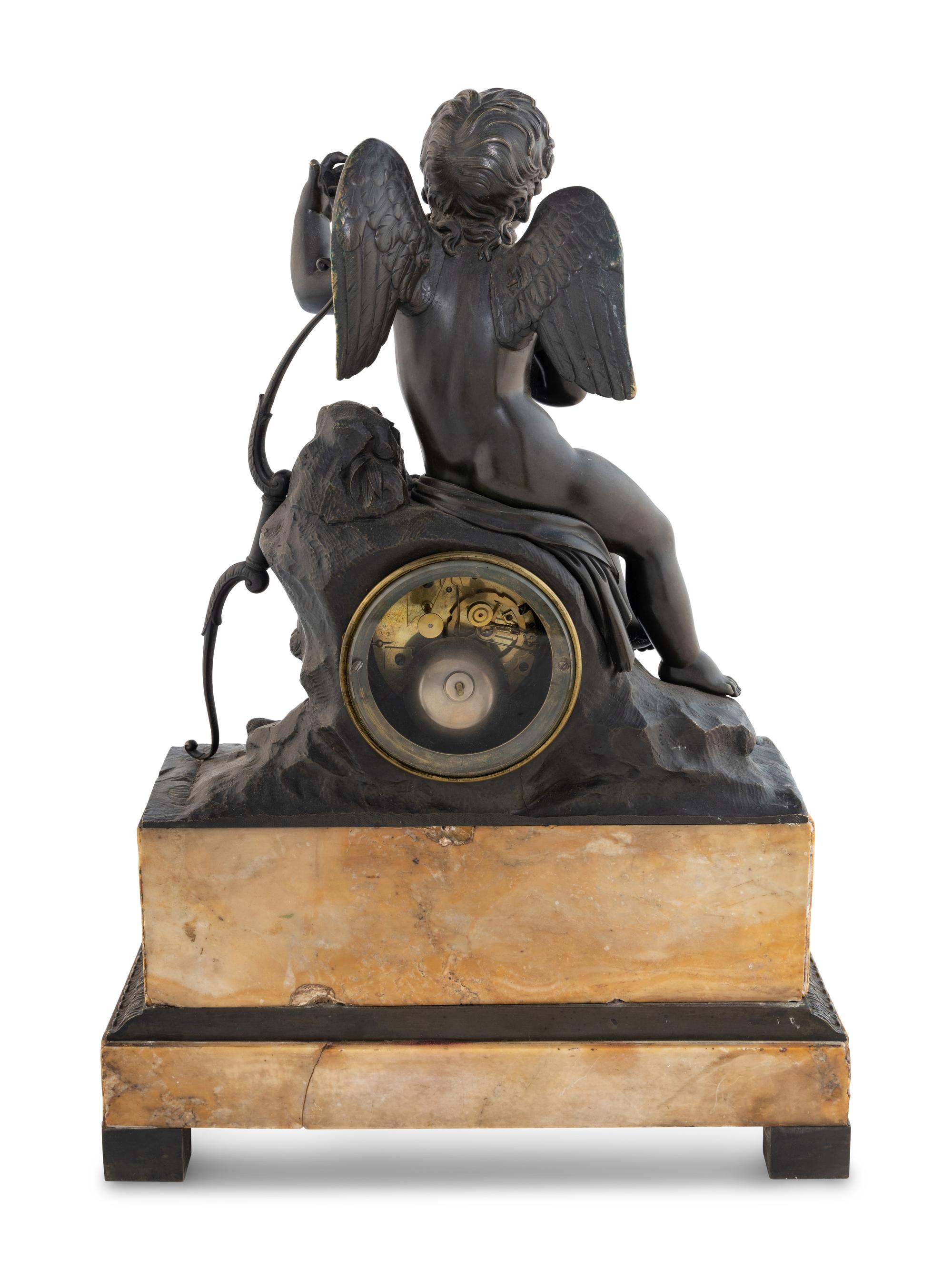 A Louis Philippe Bronze and Marble Figural Clock