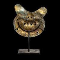 A Vicus Copper Gilt Feline Head Pendant