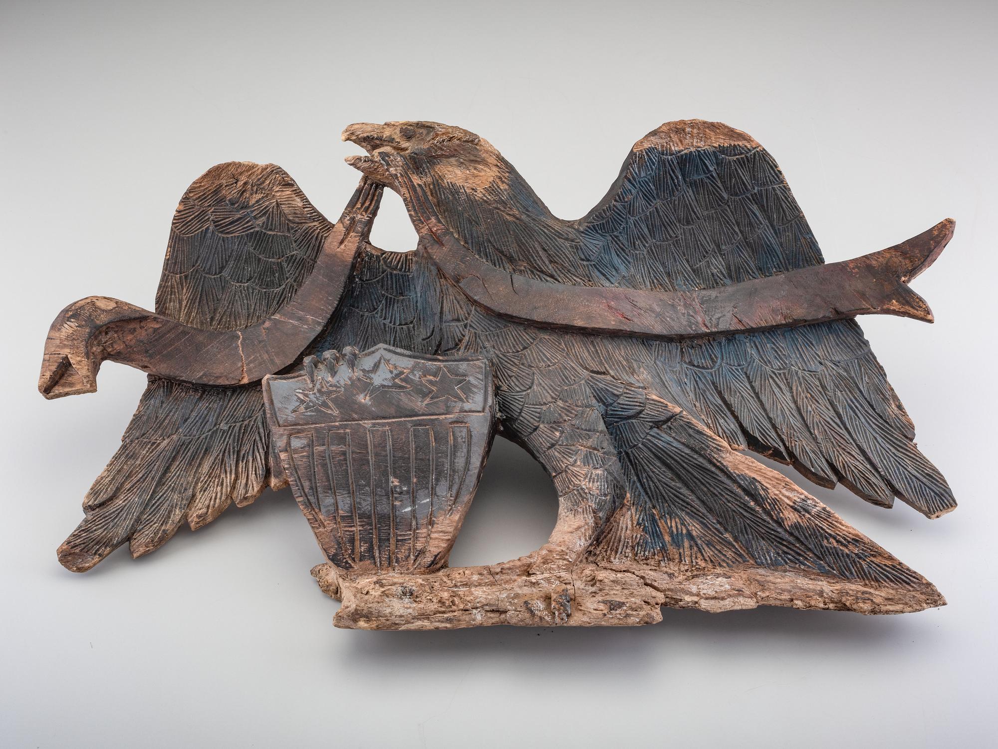 A Carved Walnut Customs House Eagle