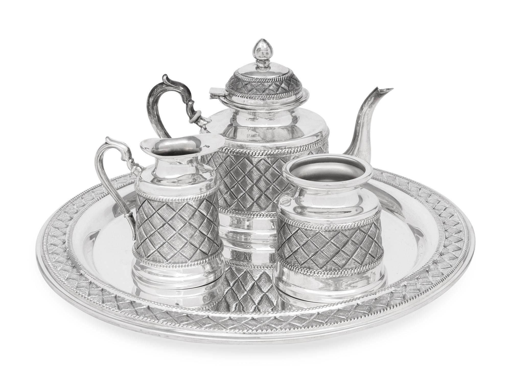 A Peruvian Silver Four-Piece Tea Service