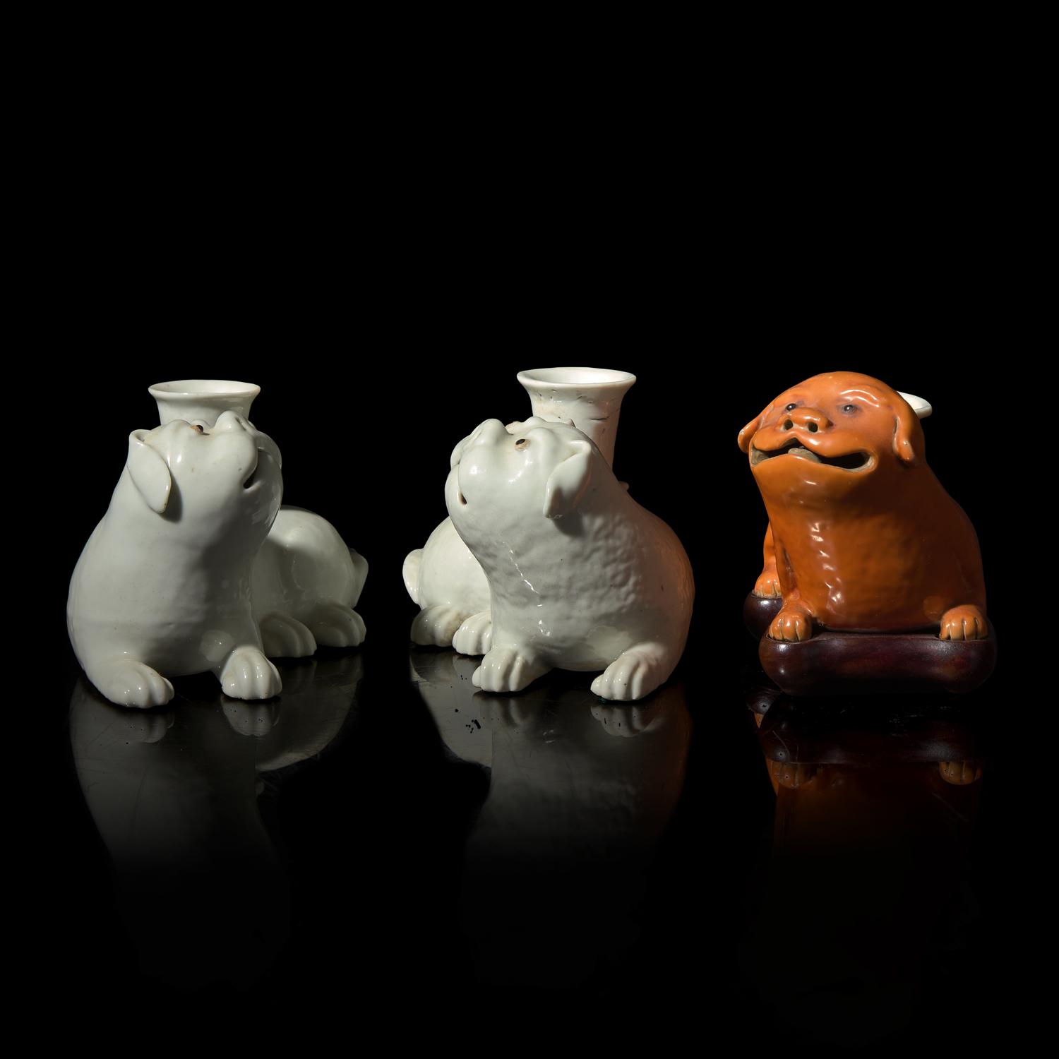Three Chinese Export Porcelain Dog Candleholders, 19th Century 清晚期 外銷臥犬燭臺三件