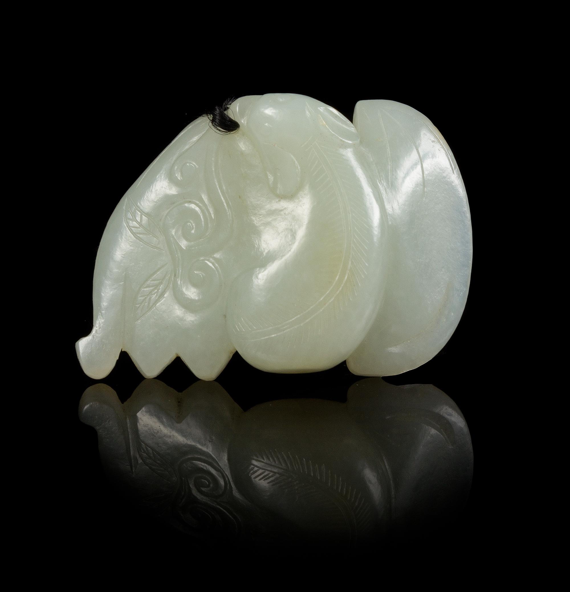 A Carved Jade Pendant Width 2 1/2 inches.