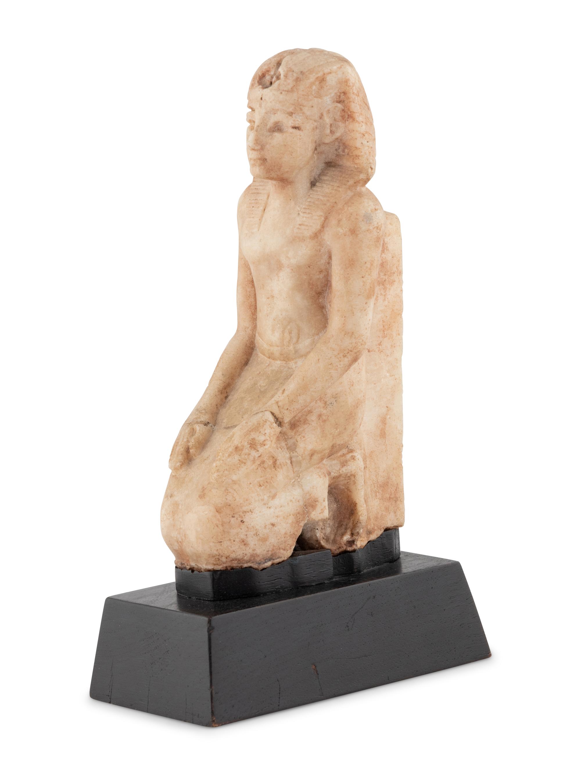 A White Stone Figure of a Kneeling Pharaoh