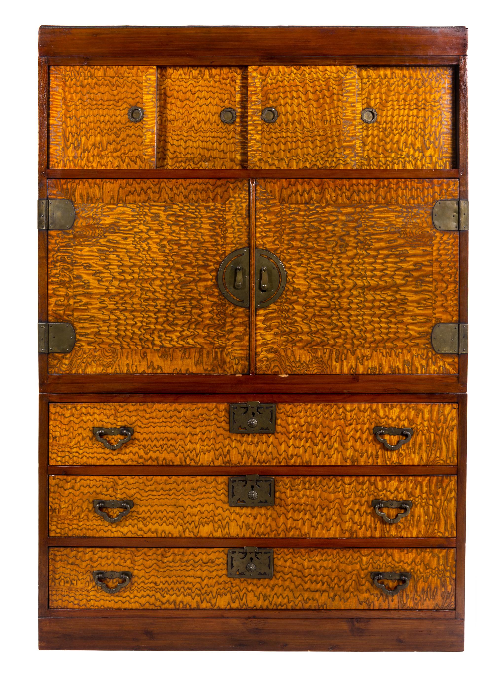 A Japanese Elm and Fruitwood Cabinet Height 65 1/4 x width 45 1/2 x depth 19 1/2 inches.