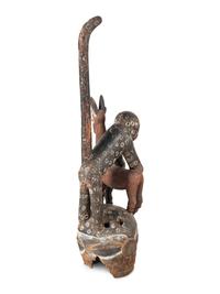 An African Carved and Painted Wood Monkey and Gazelle Figural Group