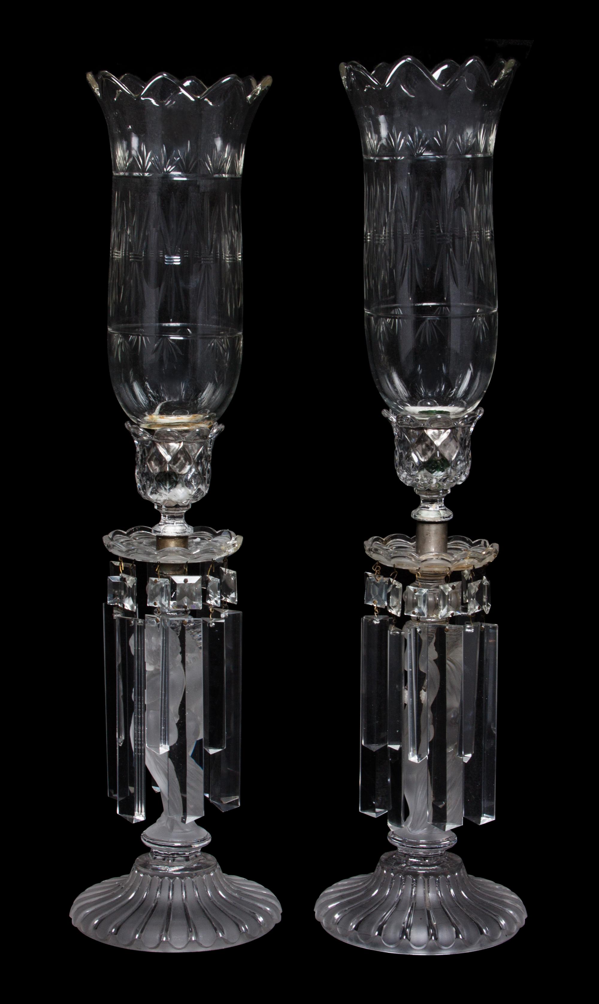 A Pair of Baccarat Frosted and Clear Glass Figural Candlesticks Height 24 inches.