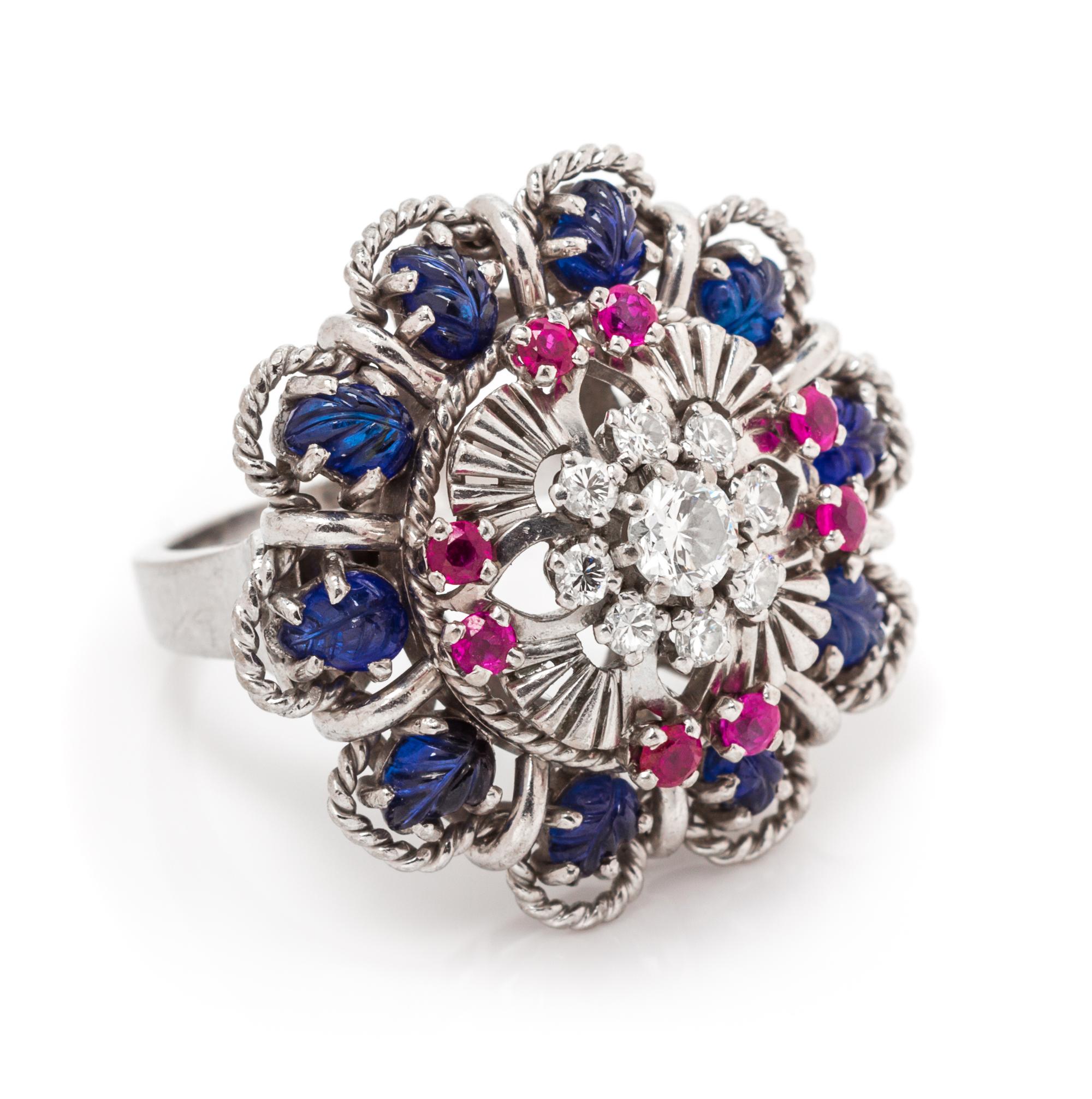 An 18 Karat White Gold, Sapphire, Ruby and Diamond Ring, 10.90 dwts.