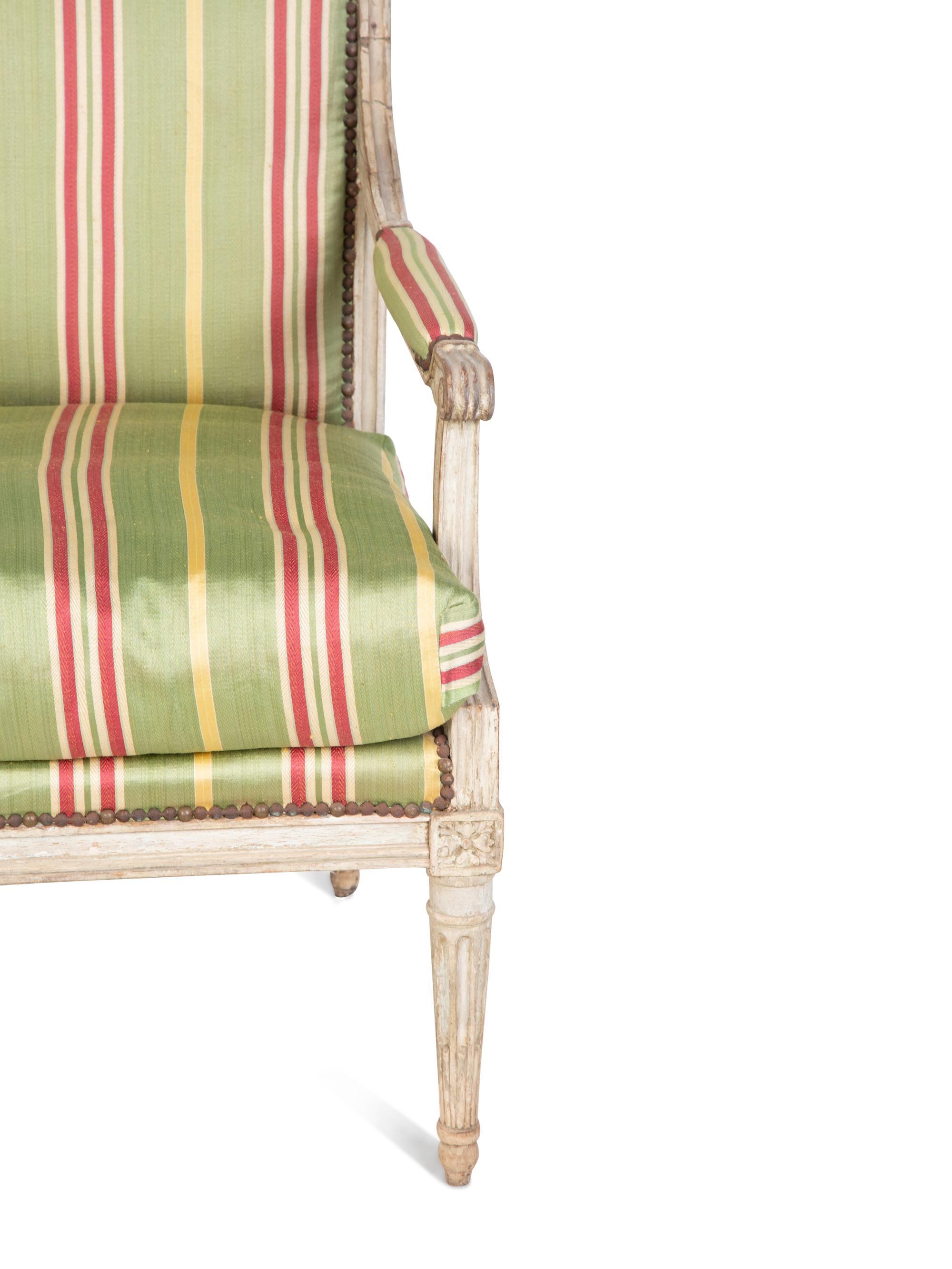 A Louis XVI Style Painted Fauteuil — 18TH/19TH CENTURY