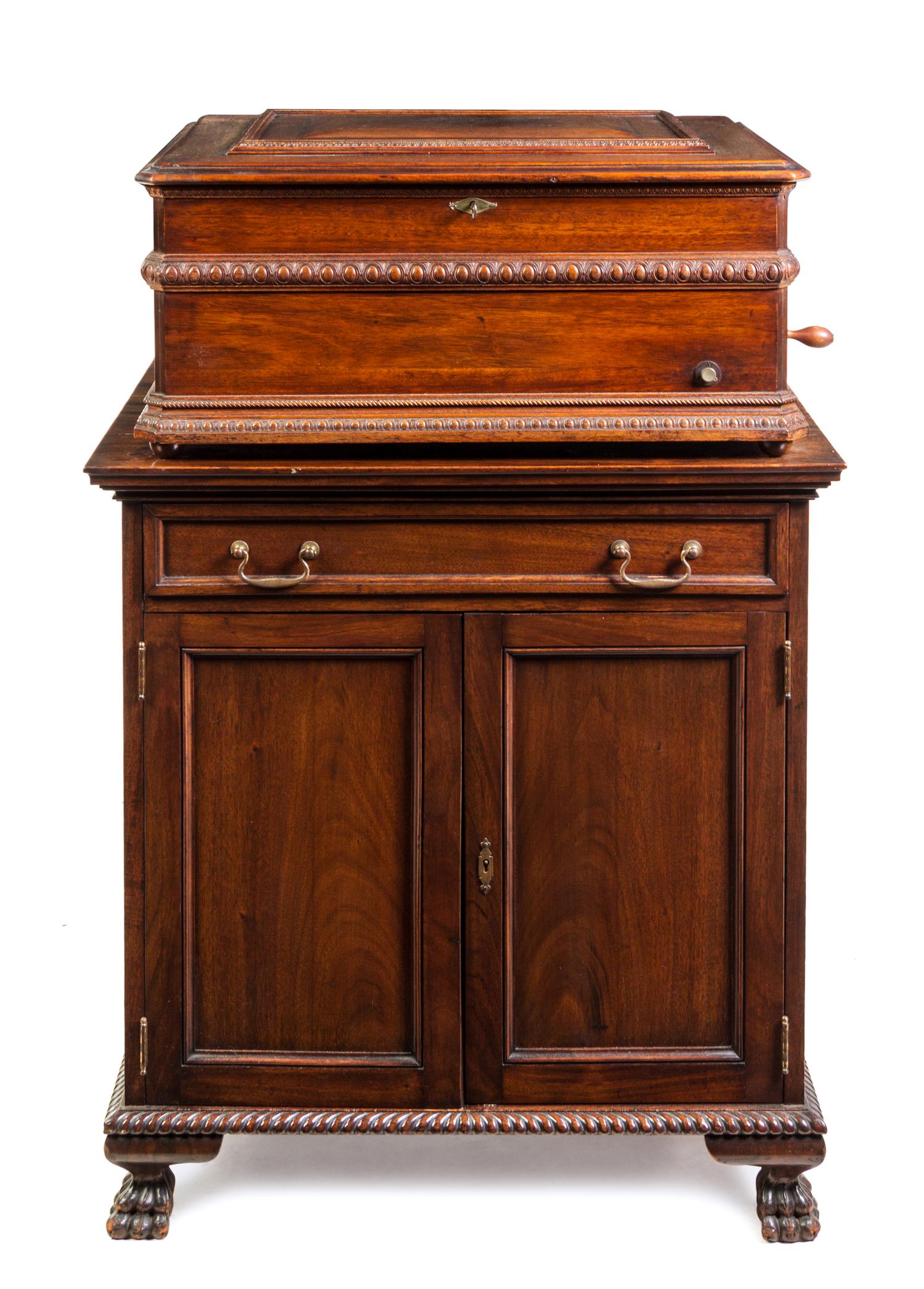 A Symphonion Mahogany Cased Disk Music Box Height 47 1/2 inches. — MID-19TH CENTURY