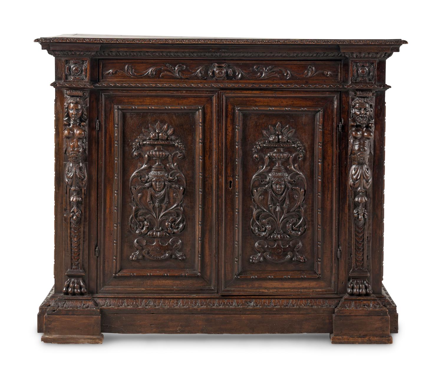 An Italian Baroque Carved Walnut Cabinet