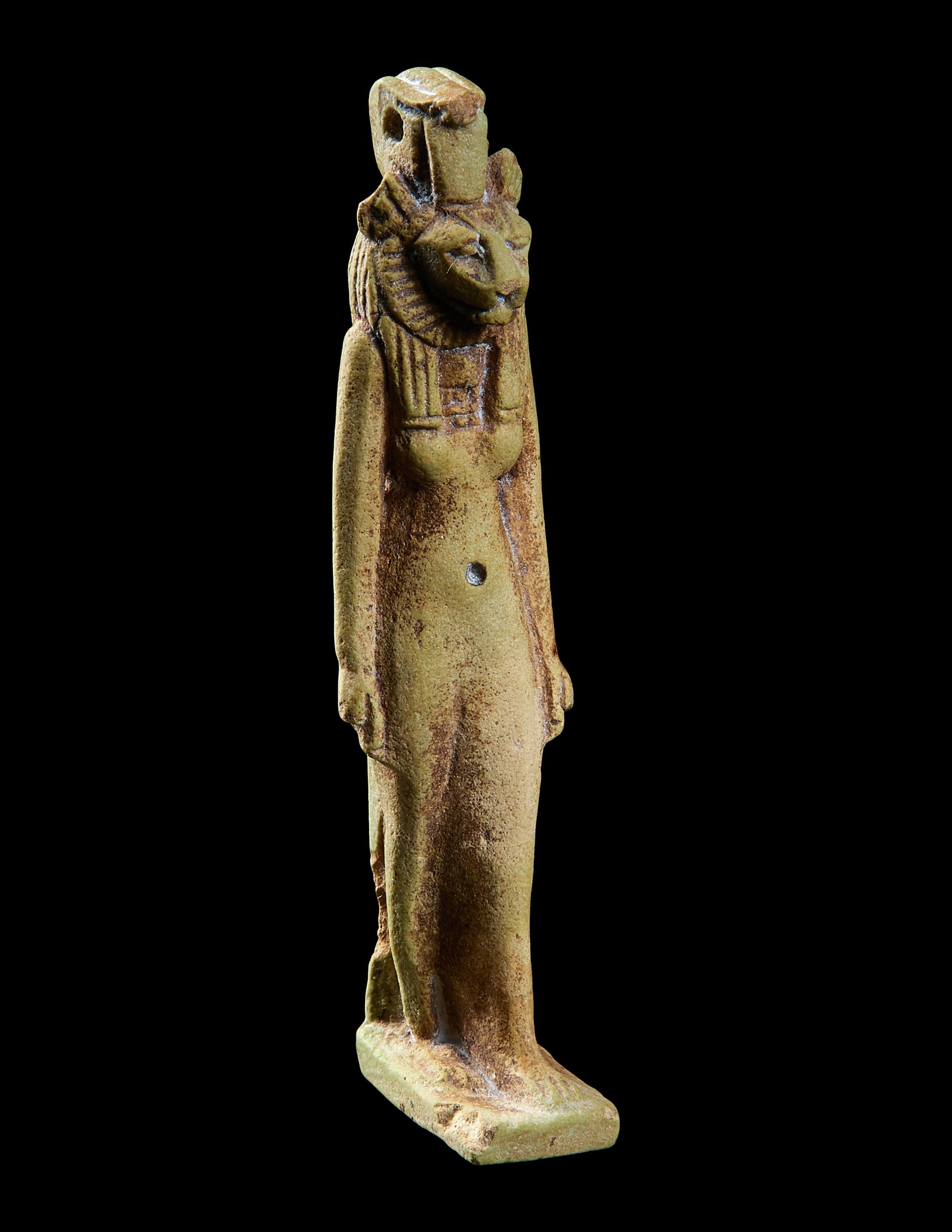 An Egyptian Faience Striding Sekhmet