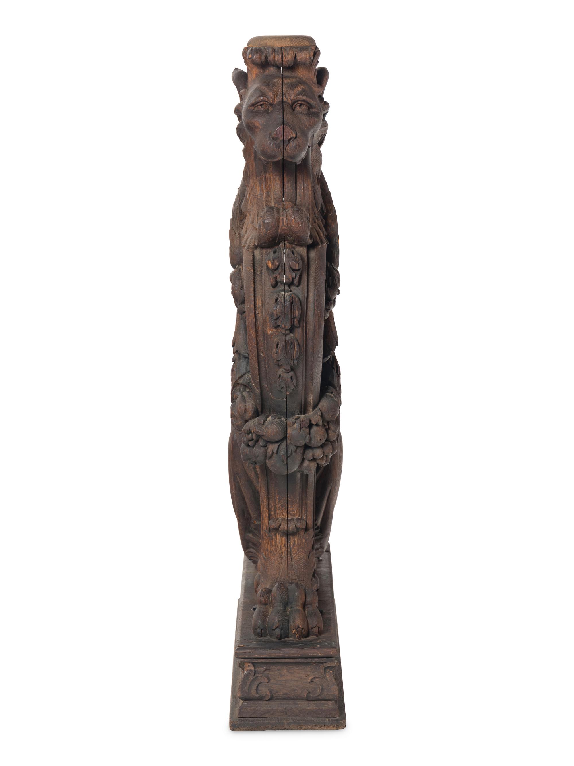 A Massive Carved Oak Griffin Newel Post