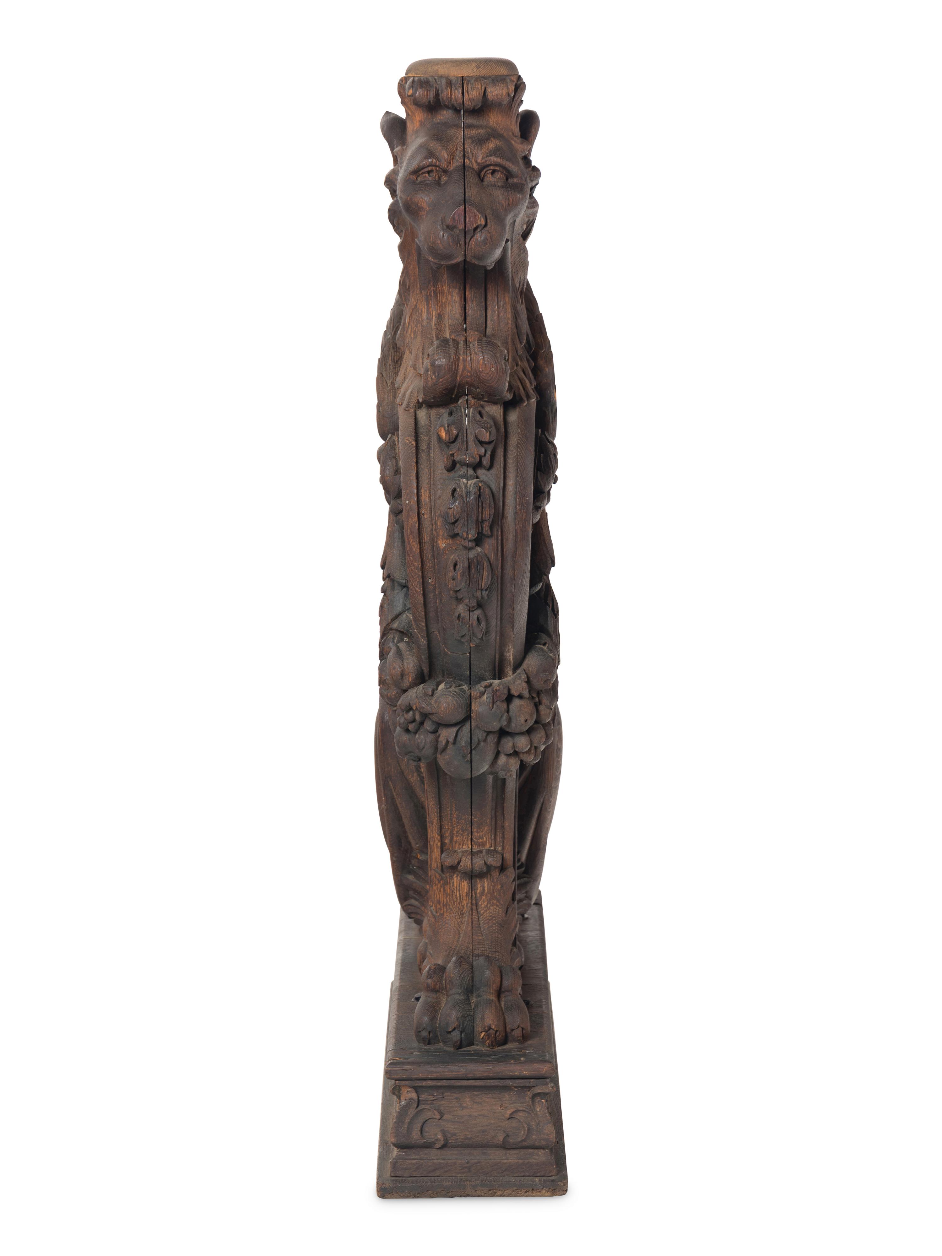 A Massive Carved Oak Griffin Newel Post