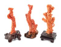 Three Chinese Carved Coral Figures on Wood Stands